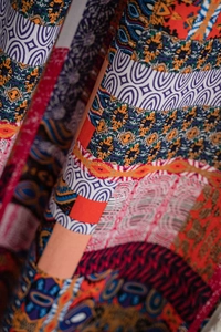 Macro detail of Bohemian printed curtain fabric with ethnic patterns and vibrant colors