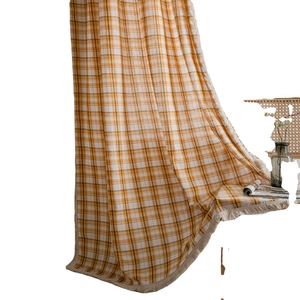 Yellow and white plaid curtains with tassels in a semi-blackout cotton linen fabric