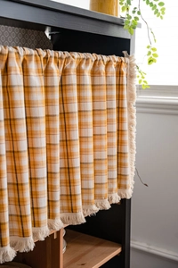 Detail view of cotton linen checkered cafe curtain with tassels and rod pocket design