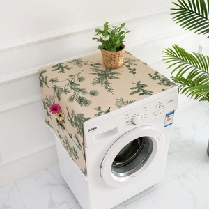 Detail of a refrigerator dust cover with side storage pockets and green pine prints