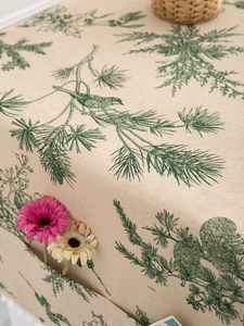 Detailed macro view of linen refrigerator cover with pine branch and bird patterns