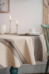 Detailed texture of navy blue striped cotton linen tablecloth with elegant rustic draping