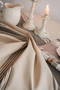 Detailed texture of navy blue striped cotton linen tablecloth with vintage decor