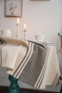 Detail of navy stripe linen tablecloth showing natural texture and soft drape