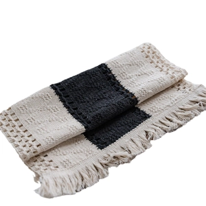 Handwoven black and white cotton table runner with stripes and fringe tassels decoration