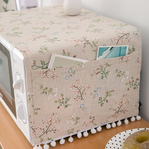 Floral cotton linen microwave dust cover with storage pockets and white pom pom trim