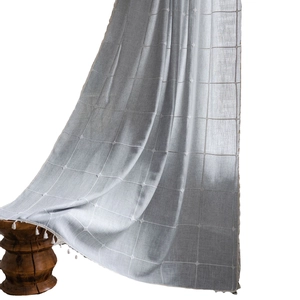 Farmhouse style light grey checkered semi-sheer curtain with elegant white tassel trim