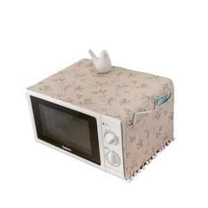 Floral cotton linen microwave dust cover with side pockets and white pom-pom trim detail