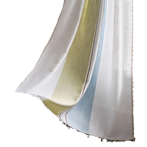 Striped ivory window curtain with green and blue embroidery and tassel fringe details