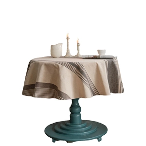 Minimalist round linen tablecloth with vintage dark brown stripes on beige background