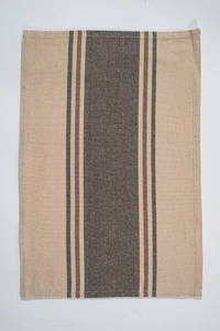 Detail view of cotton linen napkin with dark grey stripes on a beige background