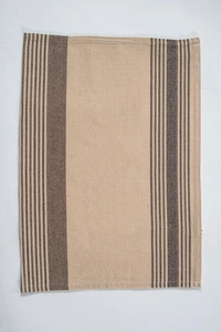 Detailed view of striped linen placemat showing high-quality fabric texture and neat stitching