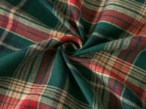 Detail shot of the red and green plaid fabric with a soft brushed texture for sofa cover
