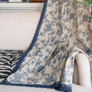 French retro cotton linen curtain with blue floral print and lace trim on sofa