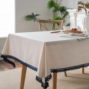 Minimalist white linen tablecloth with navy blue lace trim for rectangular dining tables