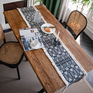 Bohemian black and white geometric jacquard table runner with decorative tassels