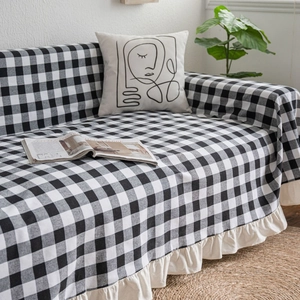 Black and white gingham sofa cover throw with ruffled cream edges for home decor