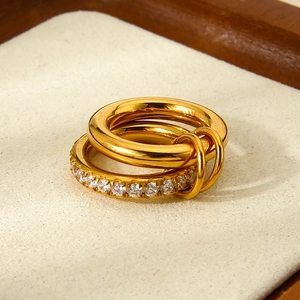 Macro view of 18K gold plated double-layer stainless steel ring with paved zircon details