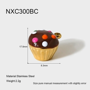 Detailed macro view of 18k gold-plated stainless steel cupcake pendant charm