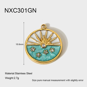 Detailed macro view of gold-plated stainless steel star and moon round pendant charm