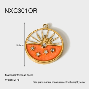 Detail of 18k gold plated stainless steel round pendant with orange enamel and stars