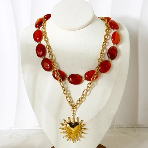 Double-layer stainless steel necklace with amber beads and heart sunburst pendant