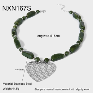 Detail showing dimensions of green beaded necklace with large textured heart pendant