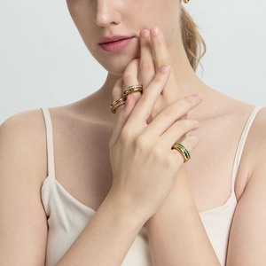 Close-up of triple-layered 18K gold plated stainless steel rings with colorful zircons