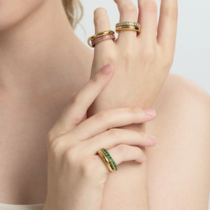 Double-layered 18K gold plated stainless steel ring with colorful zircon stones on female hand
