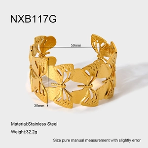 Macro view of gold stainless steel butterfly cuff bracelet with size and weight specs