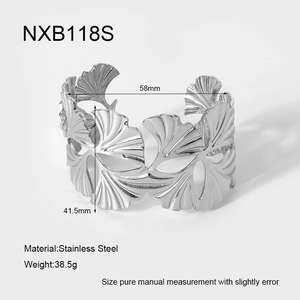 Detail view of wide hollow ginkgo leaf stainless steel cuff bracelet with 58mm diameter