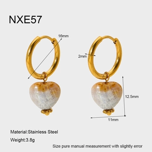 Detail view of heart-shaped shell earrings in stainless steel with precise dimensions