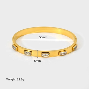 Detail showing 58mm 18K gold plated stainless steel bangle with geometric zircon stones