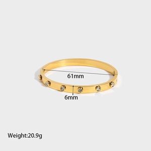Detailed macro view showing 6mm width and dimensions of the 18K gold plated zircon bangle