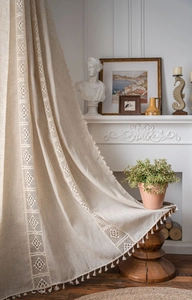 Detail of beige linen curtain featuring hollow lace splicing and elegant tassel trim fringe