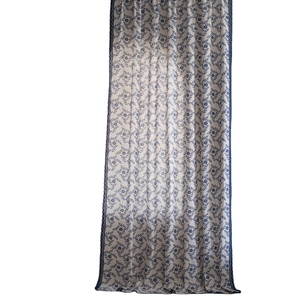 Blue floral printed semi-sheer curtain with lace trim on white background