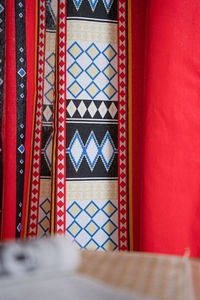 Detail of Bohemian curtain fabric with geometric diamond patterns and woven texture