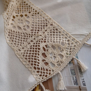 Rustic off-white crochet table runner with hollow geometric lace and tassel fringe trim