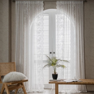 Vintage white lace curtains with floral patterns and scalloped edges for bedroom windows