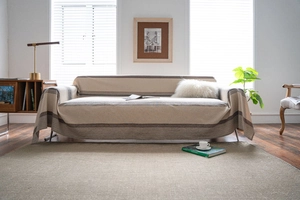 Detail of beige sofa cover with brown stripes showing textured cotton linen fabric finish