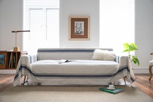 Detailed texture of navy blue striped sofa cover with thick woven fabric and soft drape