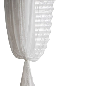 Elegant white lace sheer curtains with floral embroidery and scalloped edges for windows