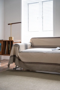 Detailed texture of coffee striped sofa throw cover with soft cotton-linen fabric weaving