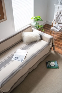 Detail shot of coffee striped woven sofa cover with premium cotton linen texture