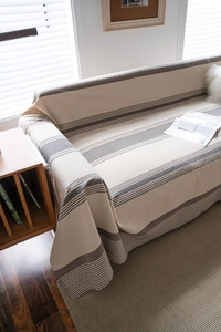 Close-up of brown and beige striped cotton linen sofa cover with textured fabric finish