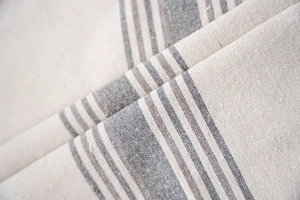 Detailed macro view of heavy coffee striped fabric texture with premium woven patterns