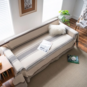 Brown striped sofa cover made of durable linen fabric for cat scratch protection