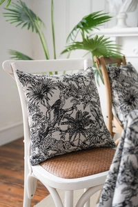 Close-up of tropical palm and animal jacquard pattern on high-quality fabric