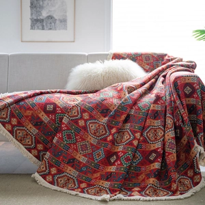 Bohemian red geometric woven sofa throw blanket with decorative tassels and ethnic patterns
