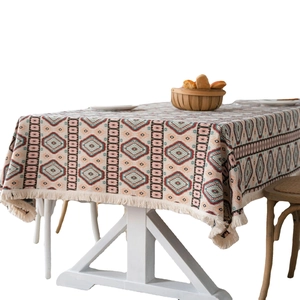 Bohemian woven tablecloth with colorful diamond geometric patterns and tassel edges